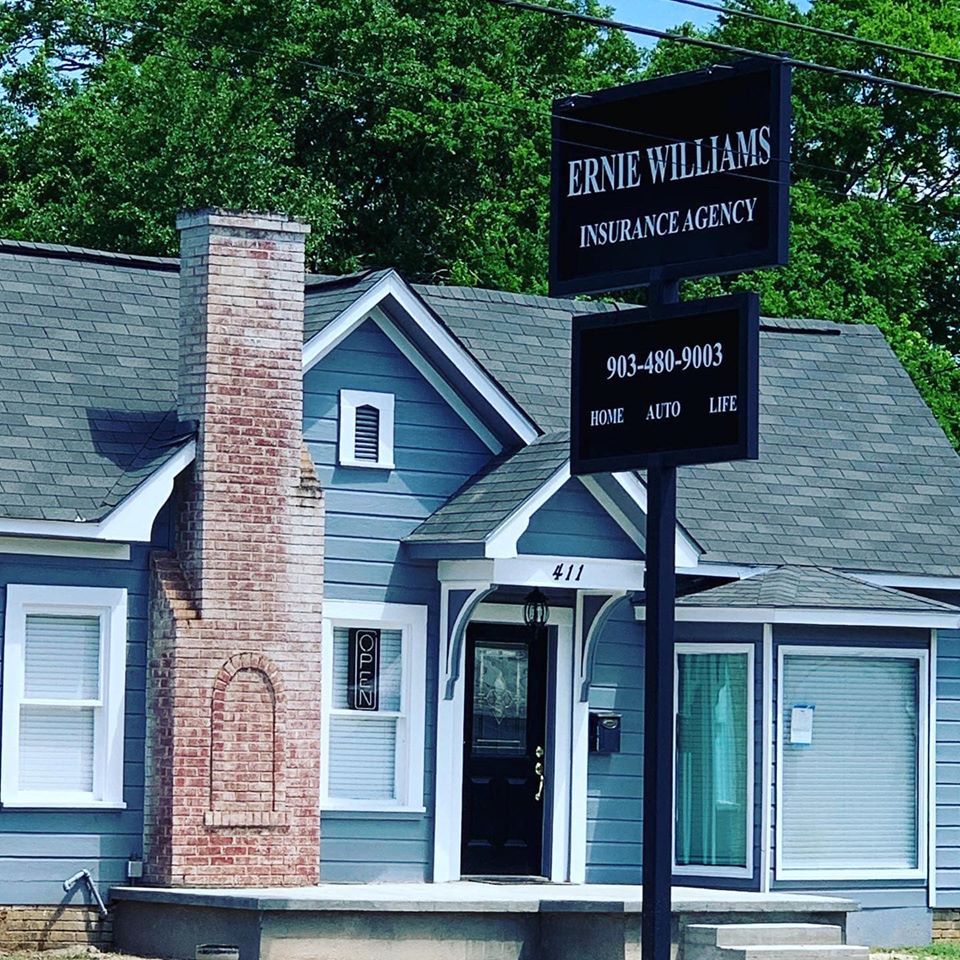 Ernie Williams Insurance Agency building with a sign in Cedar Hill, Texas.